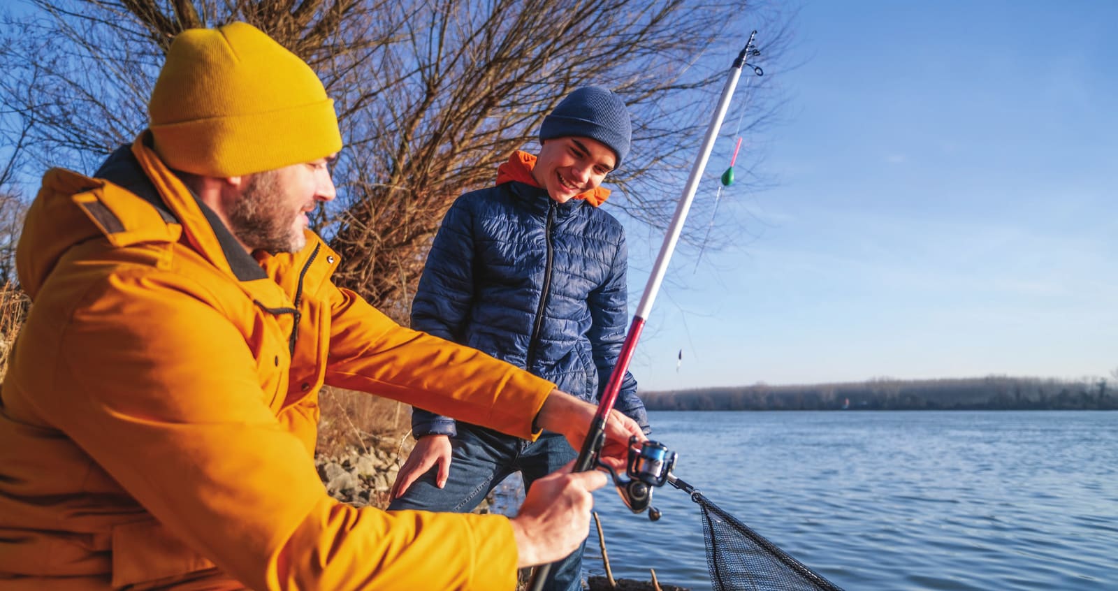 Parent and child fishing together